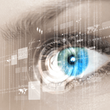 Close-up of a blue human eye with digital graphics overlay.