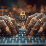 Hands typing on a laptop with glowing lock icons overlay, indicating cybersecurity.