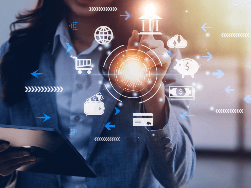 Person using a digital interface with finance and technology icons.