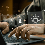 Person typing on a laptop with digital security icons overlaid, including a fingerprint and 